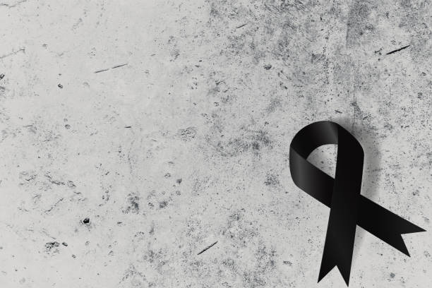 Black ribbon on concrete wall with space for text