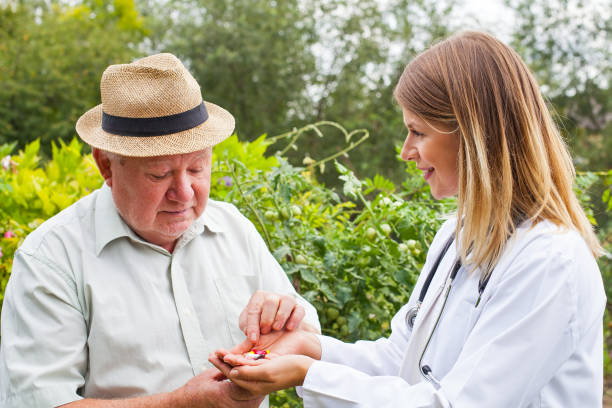 istock Doctor giving medication to elderly 843308726