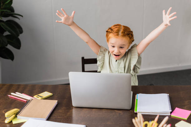 istock little girl with laptop 843313610