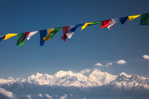 Close up of buddhist prayer flags on a sky background in Darjeeling, India.
