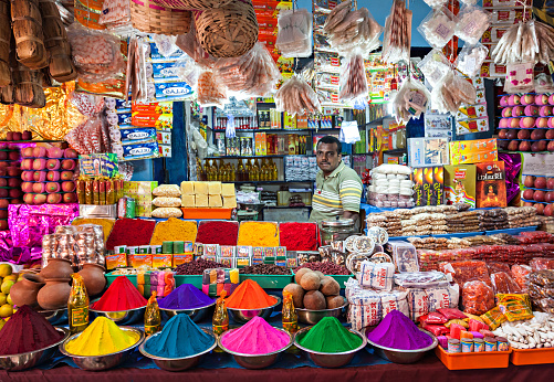 DELHI, INDIA - MARCH 26: Indian shop on March 26, 2012, Delhi, India. Small shops like this are the most common in poor region of Delhi. Tourists can see the color of India in them.