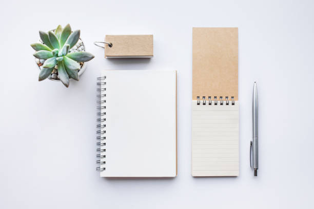 istock Business table top with mock up office supplies on white 843325022