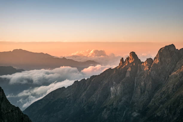 istock mountain tops in the evening with fog at the bottom 843334612