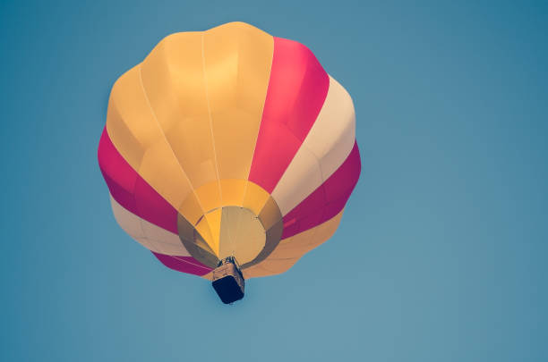 istock Colorful balloon in the blue sky. toned 843337214