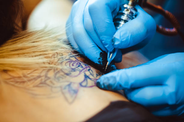 istock master tattoo woman on her back 843338920