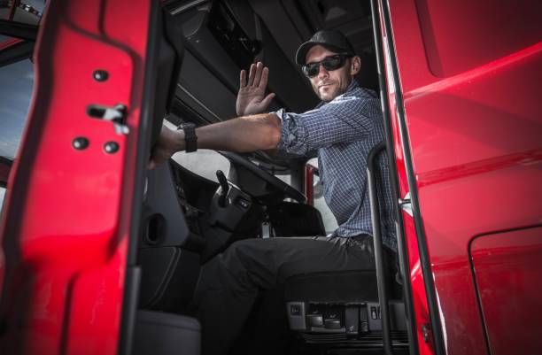 truck driver leaving warehouse - truck driver highway truck working imagens e fotografias de stock