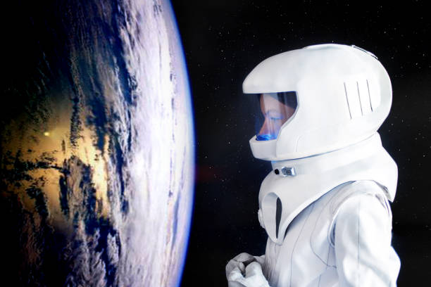 istock Astronaut looking at Earth from spaceExploration of outer space. Elements of this image furnished by NASA. 843342052
