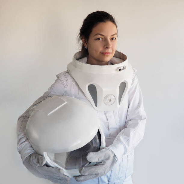 istock Female astronaut on a white background. Fantastic space suit. Exploration of outer space. 843342078