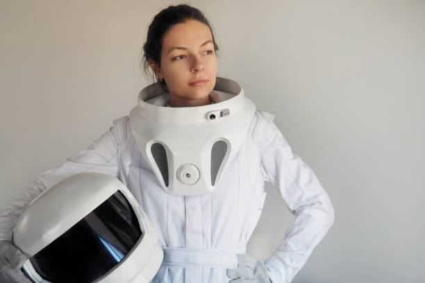 istock Female astronaut on a white background. Fantastic space suit. Exploration of outer space. 843342080