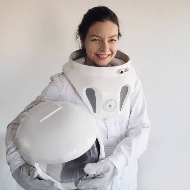 istock Female astronaut on a white background. Fantastic space suit. Exploration of outer space. 843342082