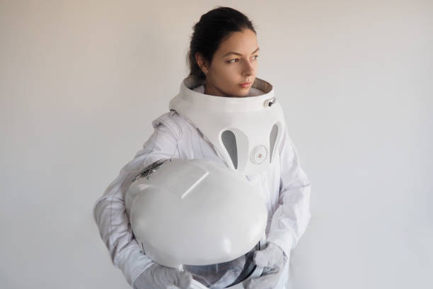 istock Female astronaut on a white background. Fantastic space suit. Exploration of outer space. 843342084