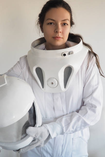 istock Female astronaut on a white background. Fantastic space suit. Exploration of outer space. 843342090