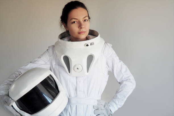 istock Female astronaut on a white background. Fantastic space suit. Exploration of outer space. 843342096