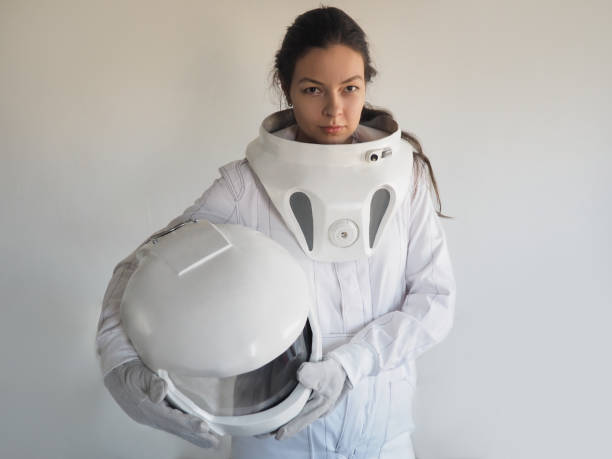 istock Female astronaut on a white background. Fantastic space suit. Exploration of outer space. 843342098