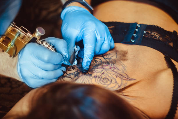 istock master tattoo woman on her back 843342194