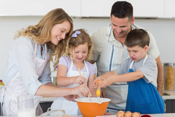 istock Family mixing egg to bake cookies 843345246