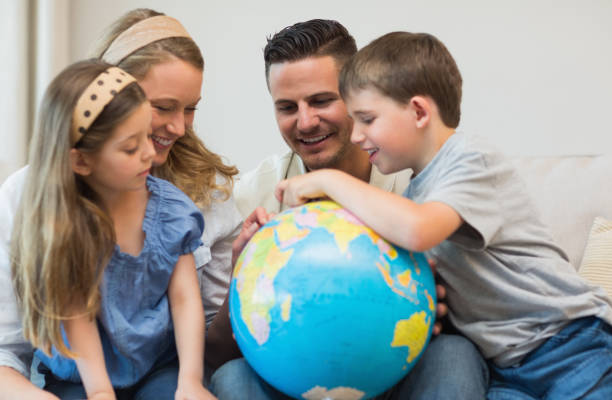 istock Family searching places on globe 843346290