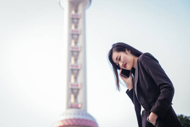 istock Chinese woman talking on cell 843350512