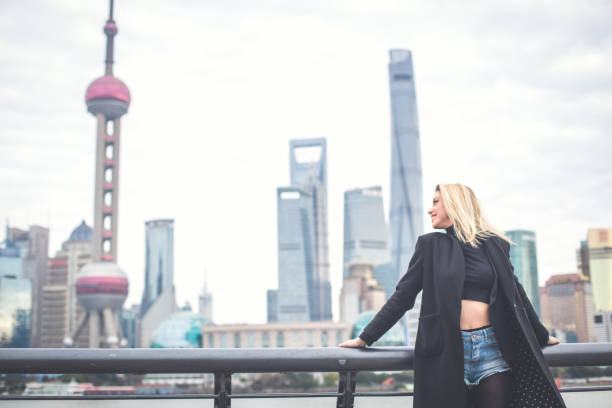 istock Blond girl in big city 843358444