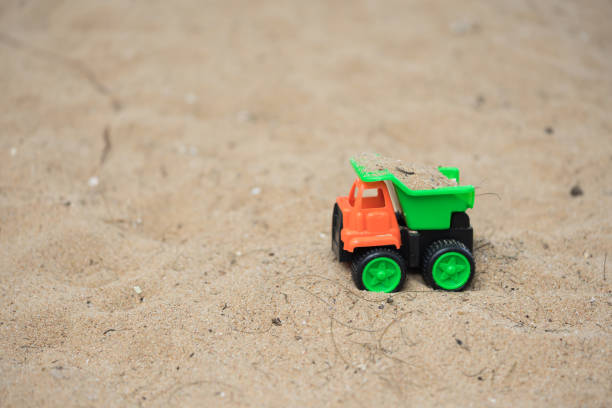 istock Close up of kid's hands playing sand 843360832