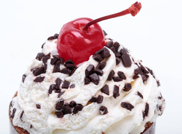 istock Black forest cake, topped with whipped cream and cherry isolated on white 843364238