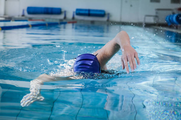 istock Fit woman swimming 843367636