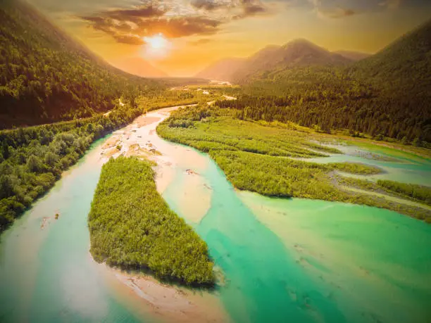 Aerial view on Isar River that flows to Sylvenstein Lake in Bavarian Alps near Garmisch Partenkirchen. Sunset over Isartal. Germany, Central Europe.