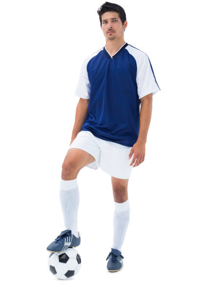 istock Football player in blue standing with the ball 843375646