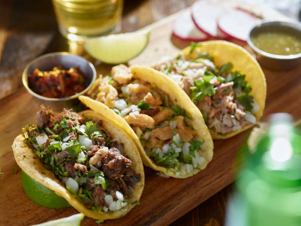 mexican street tacos with barbacoa, carnitas and Chicharrón mexican street tacos with barbacoa, carnitas and Chicharrón shot with selective focus shredded photos stock pictures, royalty-free photos & images