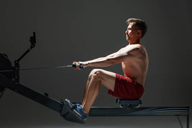 istock Man Using A Press Machine In A Fitness Club 843379102