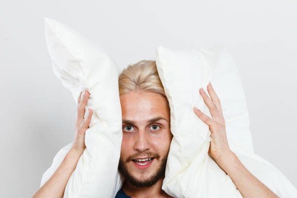 istock Man playing with pillows, good sleep concept 843379724
