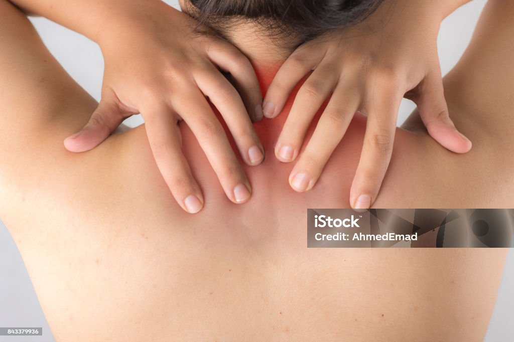 woman having pain at her neck and back Adult Stock Photo