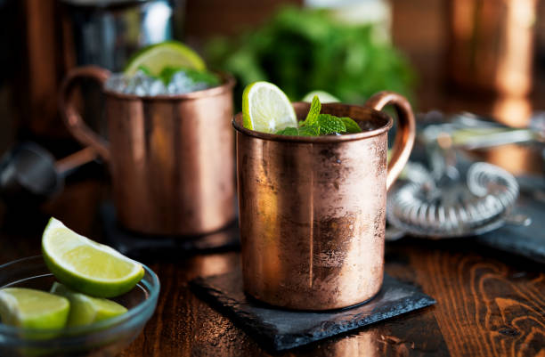 istock two moscow mules in copper mugs with garnish 843379948