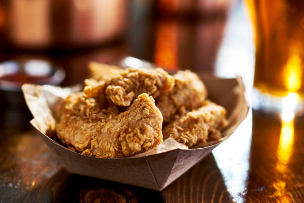 istock fried chicken tenders in paper basket 843380132