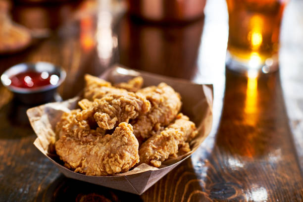 fried chicken tenders in paper basket