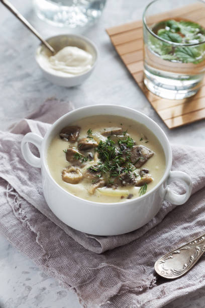 istock Mushroom cream soup with in a white bowl 843381108