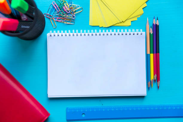 istock Back to school. Items for the school on a blue wooden table. 843386376