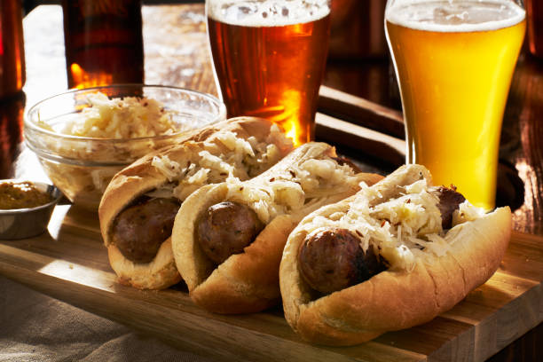 german bratwursts and sauerkraut with beer german bratwursts and sauerkraut with beer shot close up german food photos stock pictures, royalty-free photos & images