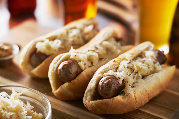 three german bratwursts and sauerkraut with beer
