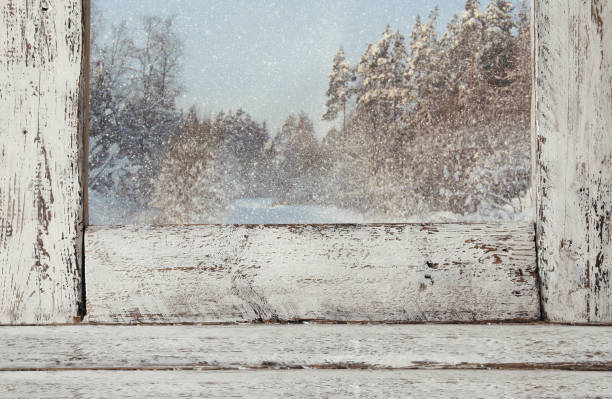 istock Old window sill in front of magical winter landscape 843393972