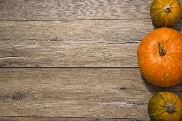 istock Halloween pumpkin head jack lantern on wooden background 843400288