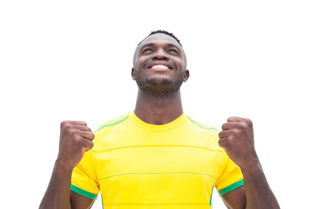 istock Football player in yellow celebrating a win 843401828