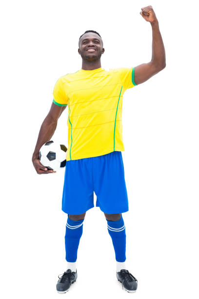 istock Football player in yellow celebrating a win 843401848