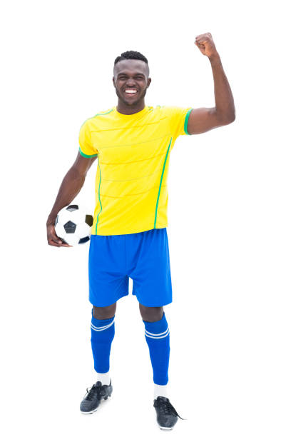 istock Football player in yellow celebrating a win 843401868