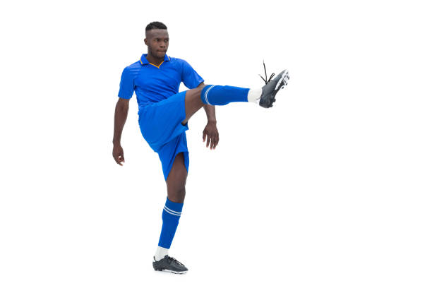 istock Football player in blue kicking 843404414