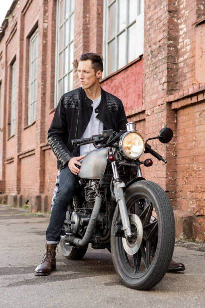 istock Brutal man sit on cafe racer custom motorbike. 843411446