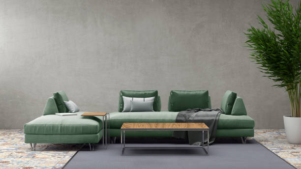 Modern pastel colored sofa in front of a blank wall - copy space template