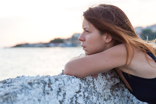 istock Young woman feeling sad on the pier 843414646