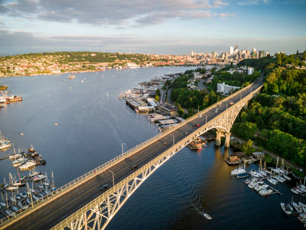 istock Helicopter Flying Over Famous Bridge in Pacific Northwest on Sunny Day 843420920