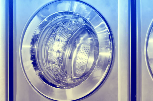 istock Round loading hatch of industrial washing machine 843421124